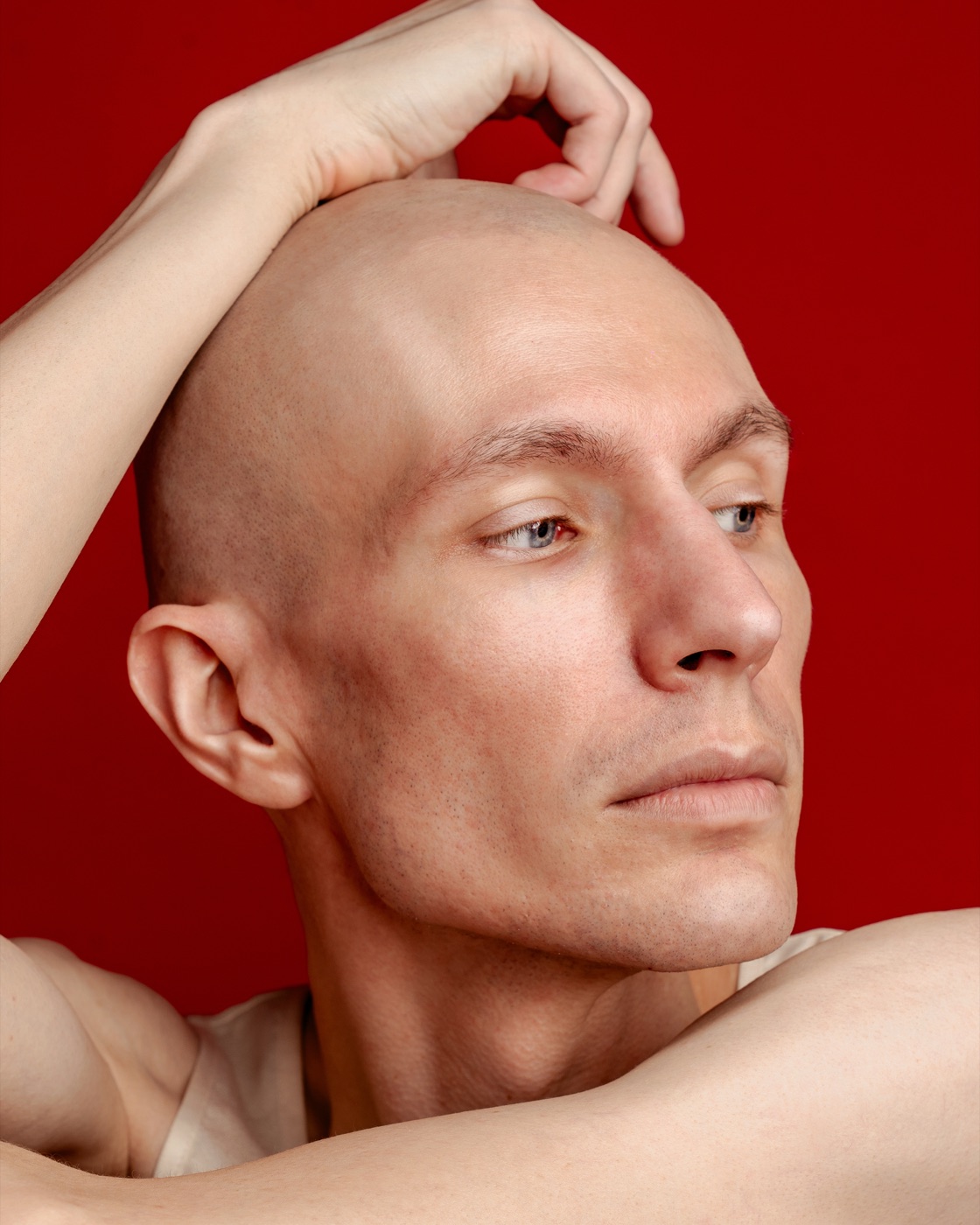 Dramatic profile actor headshot on a deep red backdrop — Look Gross Studio, Signal Hill