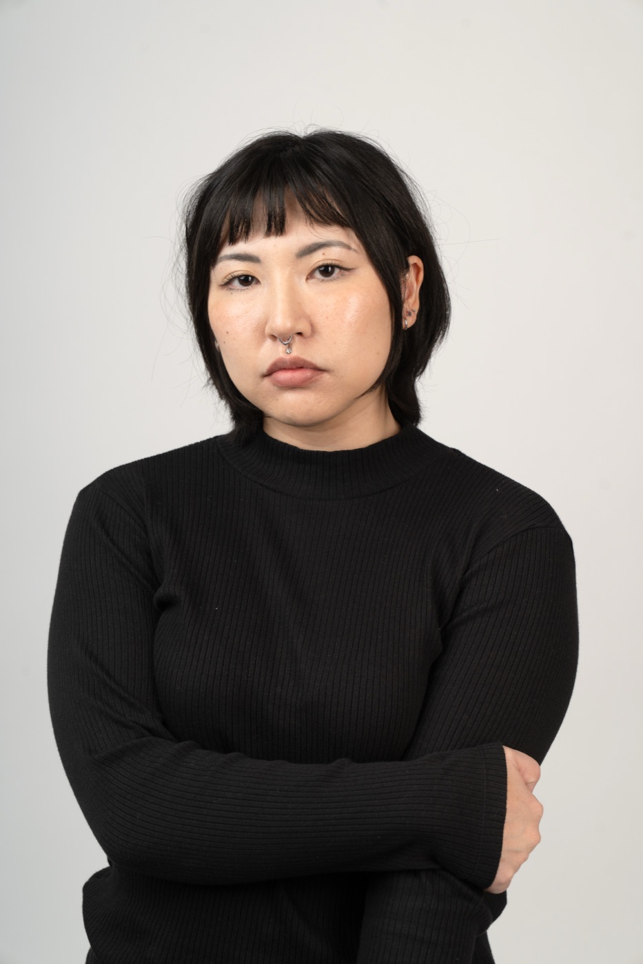 Theatrical actor headshot with a serious, grounded expression on a white backdrop — Look Gross Studio, Long Beach