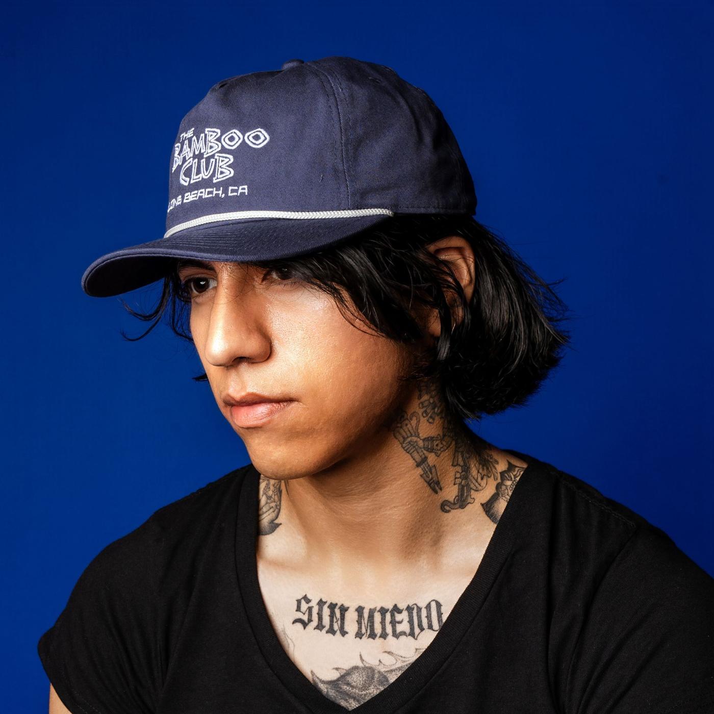Navy Bamboo Club rope hat on royal blue