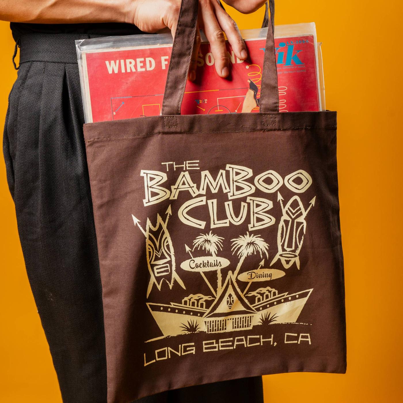 Brown Bamboo Club tote holding vintage records